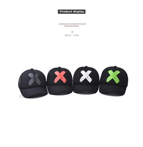 Detailed view of four black mesh trucker hats featuring 3D printed X designs in various colors
