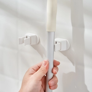 Japanese minimalist wall mounted mop holder with self-adhesive hook for bathroom organization