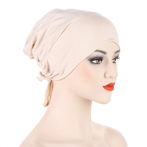 Detail of beige inner hijab cap featuring elastic drawstring and pleated back texture