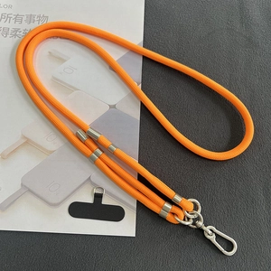 Close-up of orange braided 8mm phone lanyard with silver metal adjusters and clasp