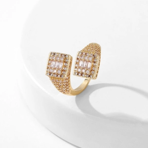 Macro shot of gold-plated copper open ring with micro-pave cubic zirconia crystals