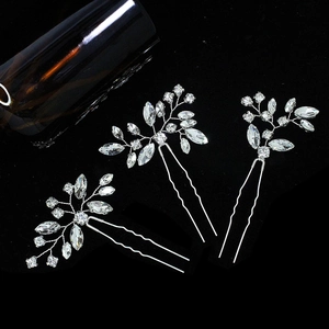 3-piece set of silver bridal hair pins with shimmering crystals and rhinestone leaf patterns