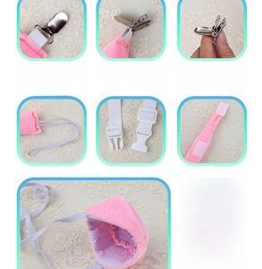 Detail view of pink plush nose cover showing clips, elastic straps and velcro fasteners