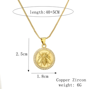 Golden sun and moon necklace detail with bee relief and zircon stones and measurements
