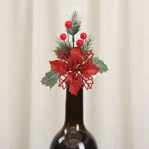 Close-up of DIY Christmas flower pick with red poinsettia and pine needles decoration