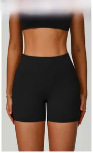 Detail view of high-waisted fitness shorts in premium black with moisture-wicking fabric