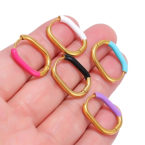 Handheld view of U-shaped gold stainless steel enamel hoop earrings in five vibrant colors