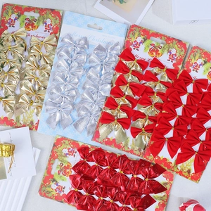Close-up of metallic finish Christmas bows in gold, red and silver for tree decoration