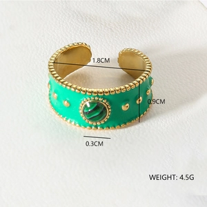 Detail view of gold dot embossed enamel ring with malachite stone and size specifications