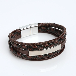 Detail view of men's braided leather bracelet with stainless steel magnetic clasp