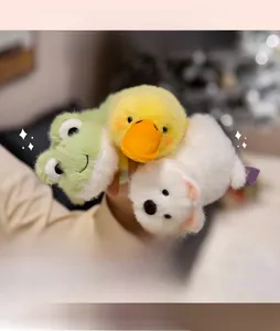 Close-up of plush frog, duck, and bear magnetic fridge magnets with soft faux fur texture