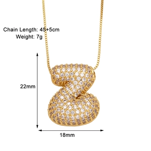 Detail view of gold letter Z pendant with white zircons showing size dimensions and chain length