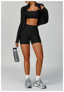 Detailed texture of rib-knit black 3-piece yoga set with zipper jacket and shorts