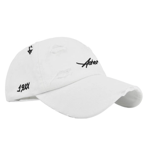 Close-up of Asher embroidery and distressed torn details on white baseball cap