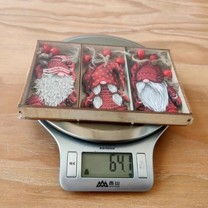 Three wooden Christmas gnome ornaments set in a gift box weighing 64.1 grams