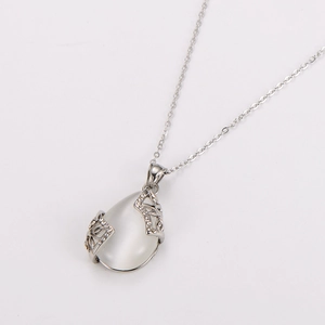 Elegant silver stainless steel necklace featuring teardrop opal pendant with diamond accents