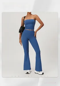 Blue high-waist yoga set featuring flared pants with contrast piping and a cropped top