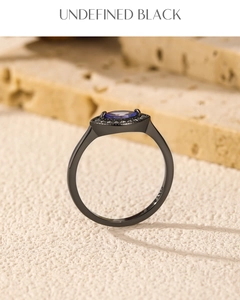 Macro shot of S925 sterling silver ring with violet stone and black gold plating