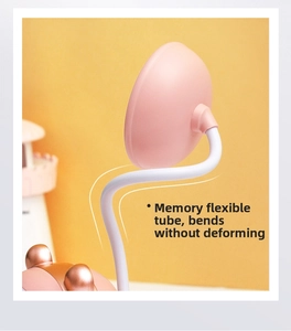 Detail of pink LED lamp with flexible neck memory hose showing bendable feature
