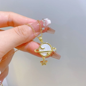 Titanium steel necklace with shell planet pendant and star detail on model neck