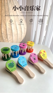 Close-up of wooden cartoon animal rattles and castanets for toddlers early music learning