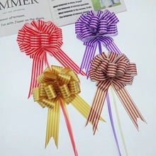 Detailed view of colorful striped pull bow ribbons for festive gift wrapping decorations