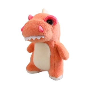 Cute orange and white plush dinosaur toy with big eyes standing on white background