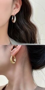 Detailed view of minimalist geometric C-shaped earrings in polished gold and silver finishes