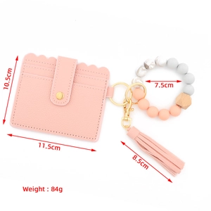 Pink faux leather card wallet with silicone beaded wristlet and fringe tassel keychain
