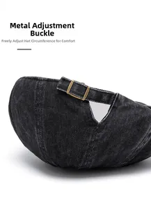 Close-up of bronze metal adjustable buckle on washed denim newsboy cap back strap