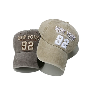 Vintage washed New York 92 baseball caps in taupe and khaki colors with 3D embroidery