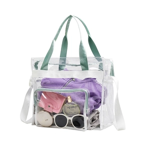 Spacious clear PVC beach bag with mint green handles showing interior storage capacity