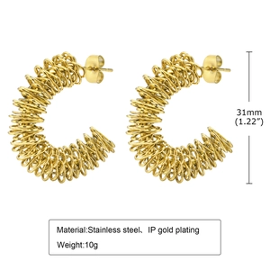 Detail view of 31mm twisted coil earrings in gold-plated stainless steel weighing 10g