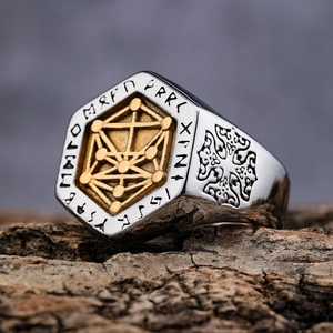 Detailed macro shot of vintage Viking signet ring with gold Nordic runes on tree bark