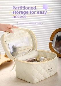 Quilted makeup bag detail showing mesh compartment with makeup brushes and cosmetics