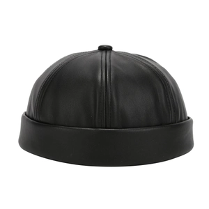 Minimalist black PU leather skull cap with smooth texture and vintage docker style