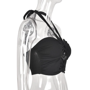 Detail of the side view showing ruched texture and halter design on this black crop top