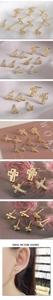 Detailed view of 18K gold plated cross stud earrings with micro-inlaid zircon accents