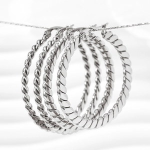 Polished silver stainless steel twisted hoop earrings with a textured rope pattern design