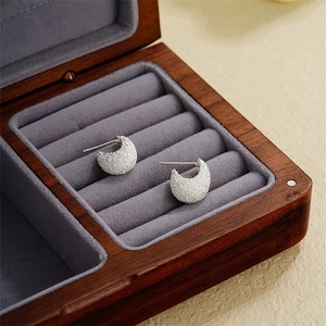 Frosted geometric C-shape silver stud earrings with a sparkling textured sandblasted finish