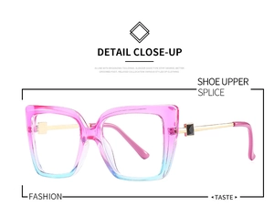 Detail of pink and blue gradient cat eye frames with gold metal temples and rhinestones
