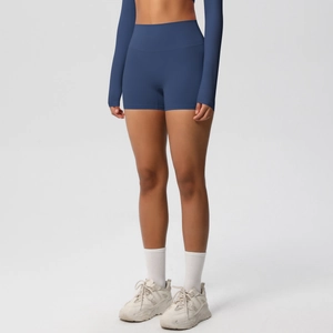 Detail of high-waisted navy blue yoga shorts and long sleeve top set for fitness