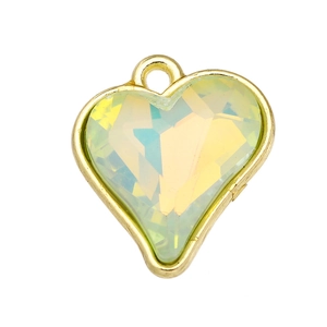 Macro detail of heart crystal pendant with gold plating and iridescent facets