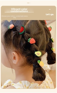 Close-up of colorful fruit charm elastic hair ties for children's braided hairstyles