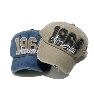Distressed denim baseball caps featuring 1964 America embroidery in navy and khaki