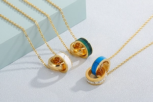 Detail of interlocking double-ring necklaces with rhinestones and faux gemstones