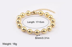 Detailed view of 18k gold plated bead bracelet with 8mm spheres and 5cm extension chain