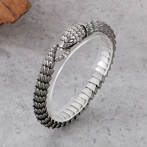 Vintage stainless steel snake bracelet with textured silver scales and retro fashion style