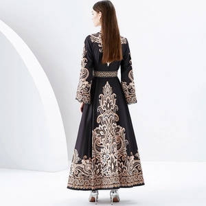 Back view of a long baroque print dress with stand collar and elegant A-line silhouette