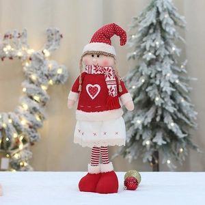 Handcrafted knitted Christmas girl doll with red polka dot hat and snowflake scarf decoration
